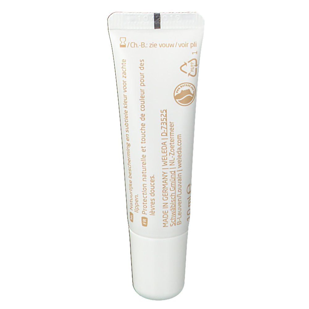 Baume à lèvres Weleda Nude. Tube blanc avec texte et logo. Fabriqué en Allemagne. Volume: 10 ml.