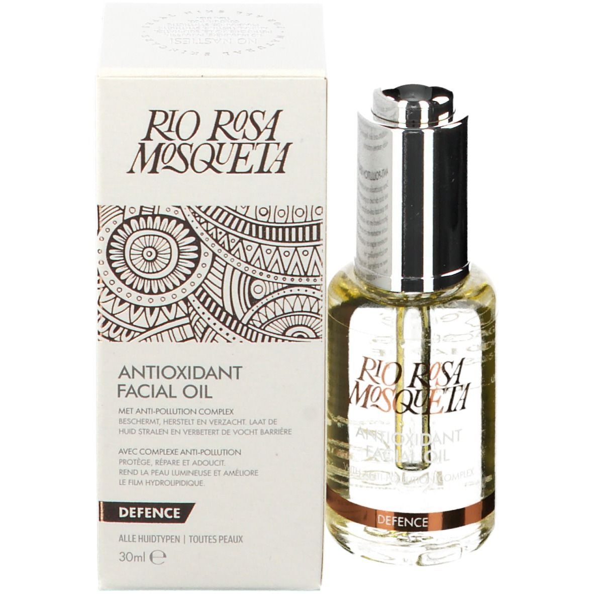 Huile faciale et emballage. Flacon avec pipette argentée, à côté boîte. Inscription : Rio Rosa Mosqueta, Antioxidant Facial Oil, Defence.