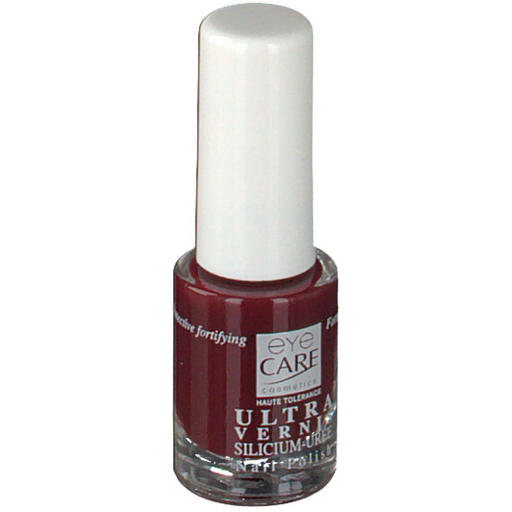 Flacon de vernis à ongles avec bouchon blanc. Vernis rouge foncé. Inscription: EYE CARE, ULTRA VERNIS, SILICIUM-UREE, Nail Polish.