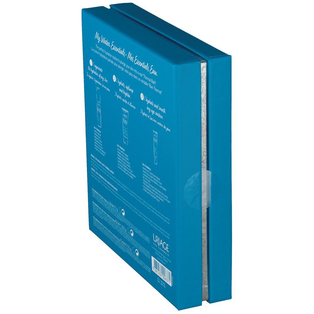 Coffret cadeau bleu partiellement ouvert. Arrière avec informations produit et logo Uriage. Fenêtre montrant les produits.