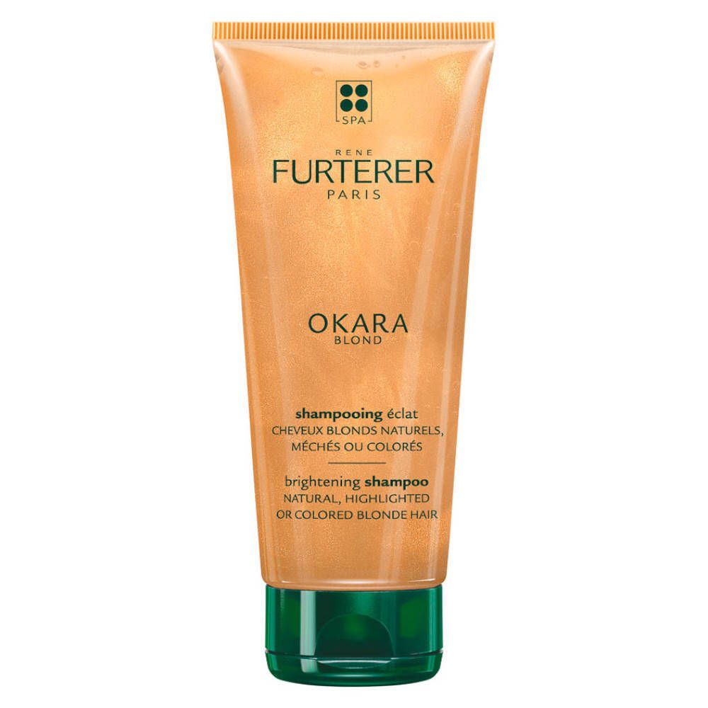 Tube de shampooing doré. Bouchon vert. Inscription: OKARA Blond, shampooing éclat, cheveux blonds.
