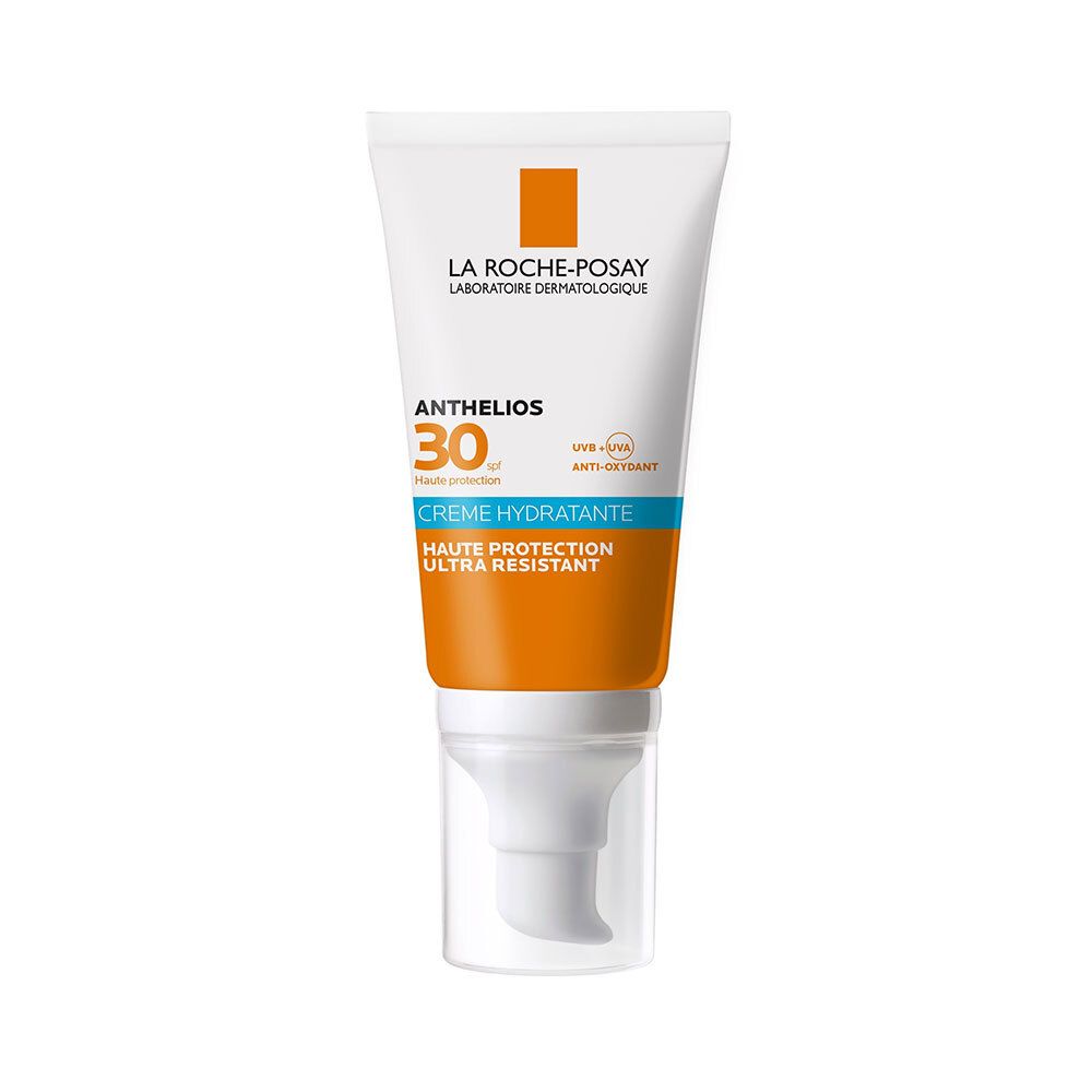Witte tube met oranje en blauw design. Productnaam en SPF zichtbaar.