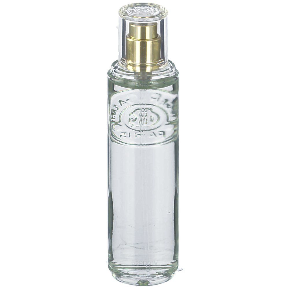 Cilindrische glazen fles met verstuiver. Transparant, met gouden verstuiver en transparante dop. Reliëflogo op de voorkant.