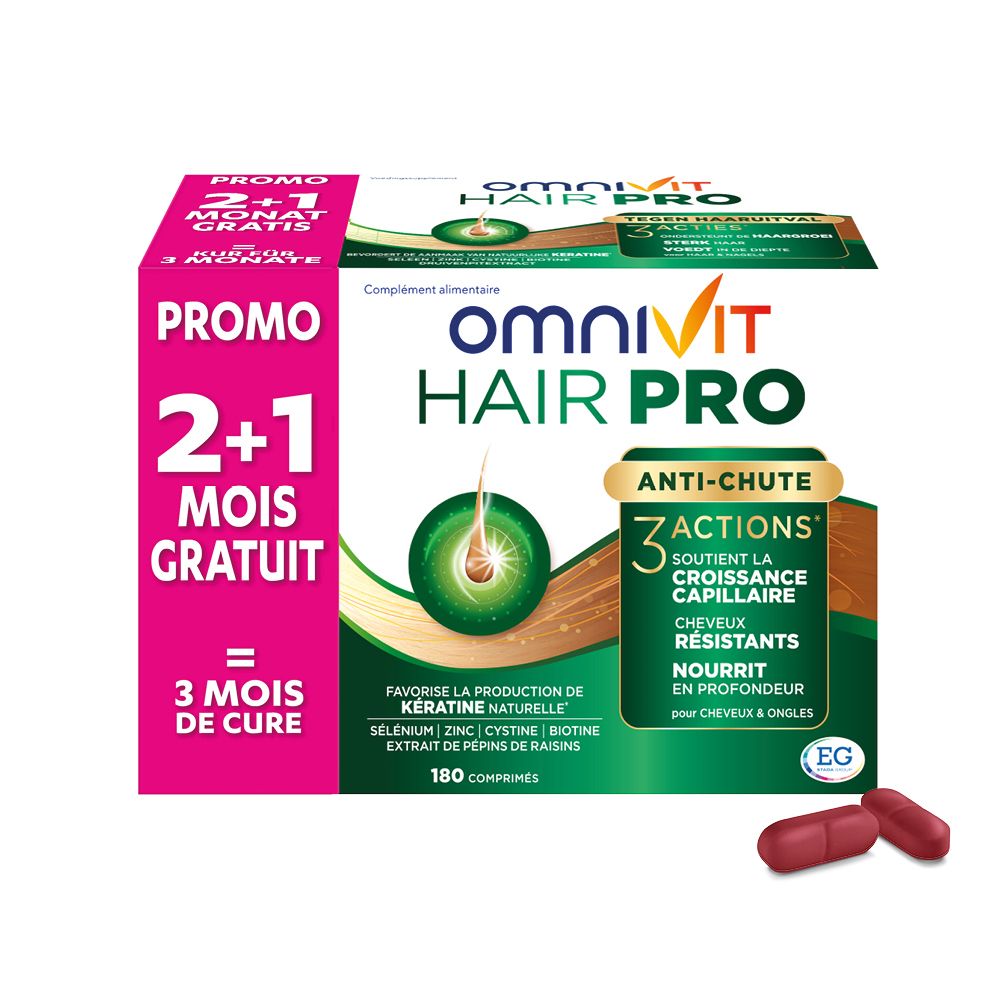 Boîte Omnivit Hair Pro avec 180 comprimés. Deux comprimés à côté.