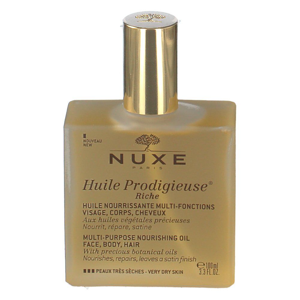 Quadratische Glasflasche mit goldfarbenem Verschluss. Beschriftung: NUXE Huile Prodigieuse Riche. Für sehr trockene Haut.