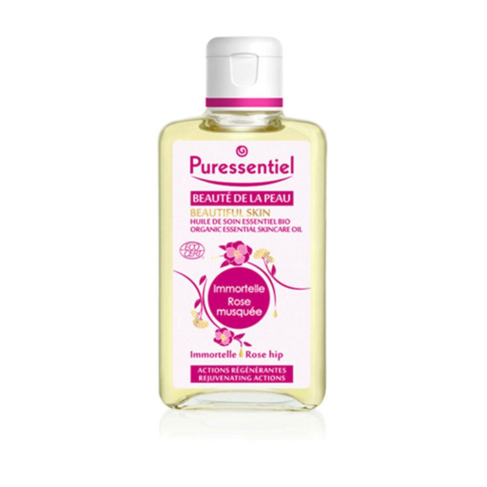 Transparante huidverzorgingsolie in een vierkante fles met witte dop. Etiket met productnaam en ingrediënten.