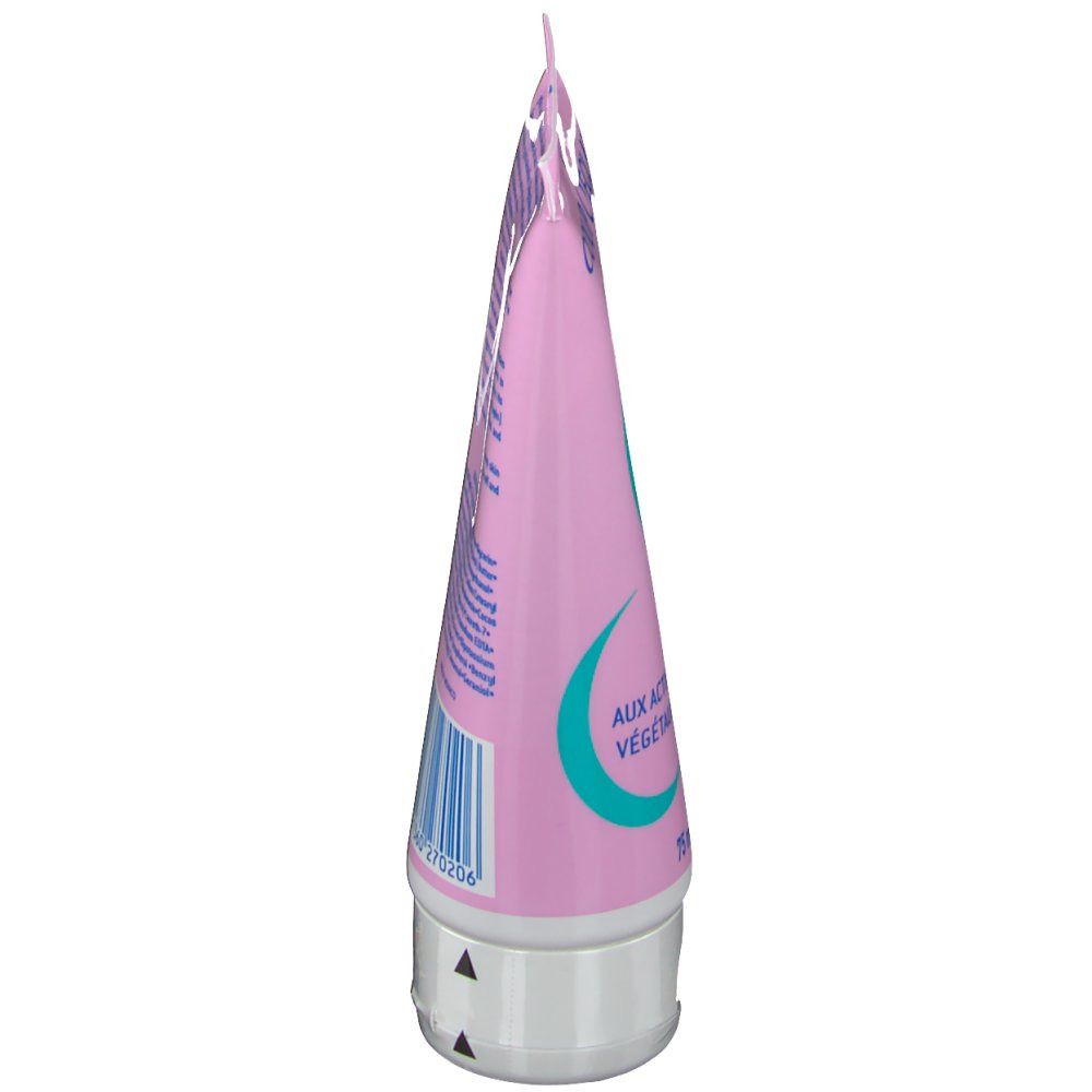 Vue latérale du tube rose avec bouchon blanc. Inscription: Aux actifs végétaux, 75 ml.