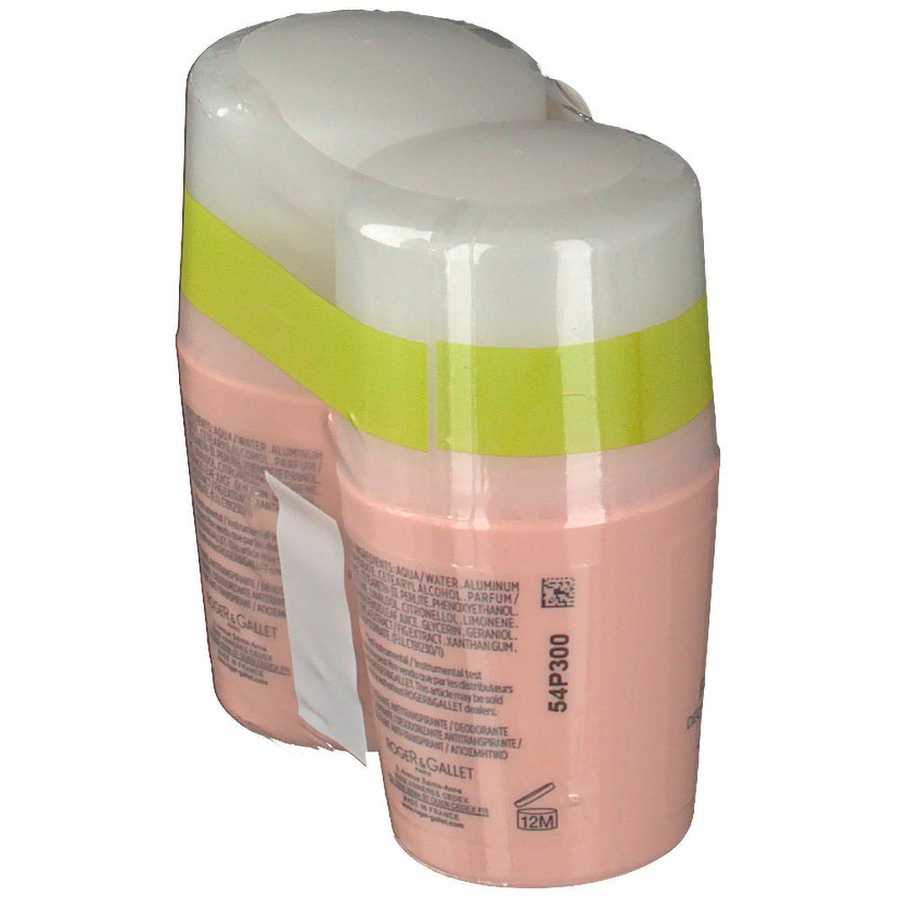 Deux déodorants roll-on roses, couvercles blancs, emballés. Dos avec texte. Étiquette Duo-Pack. Symbole 12M.