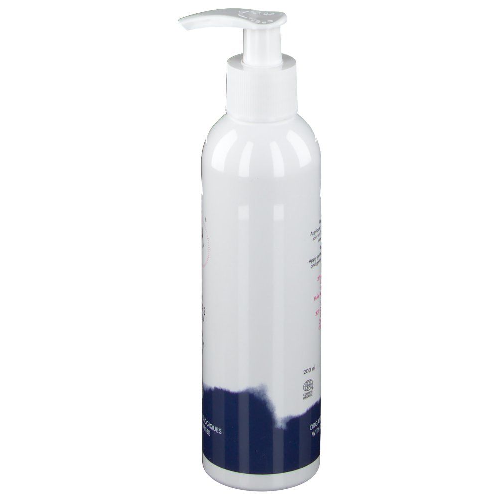 Witte fles met pomp, zijaanzicht. Tekst en logo. Donkerblauwe streep onderaan. Biologische certificering.