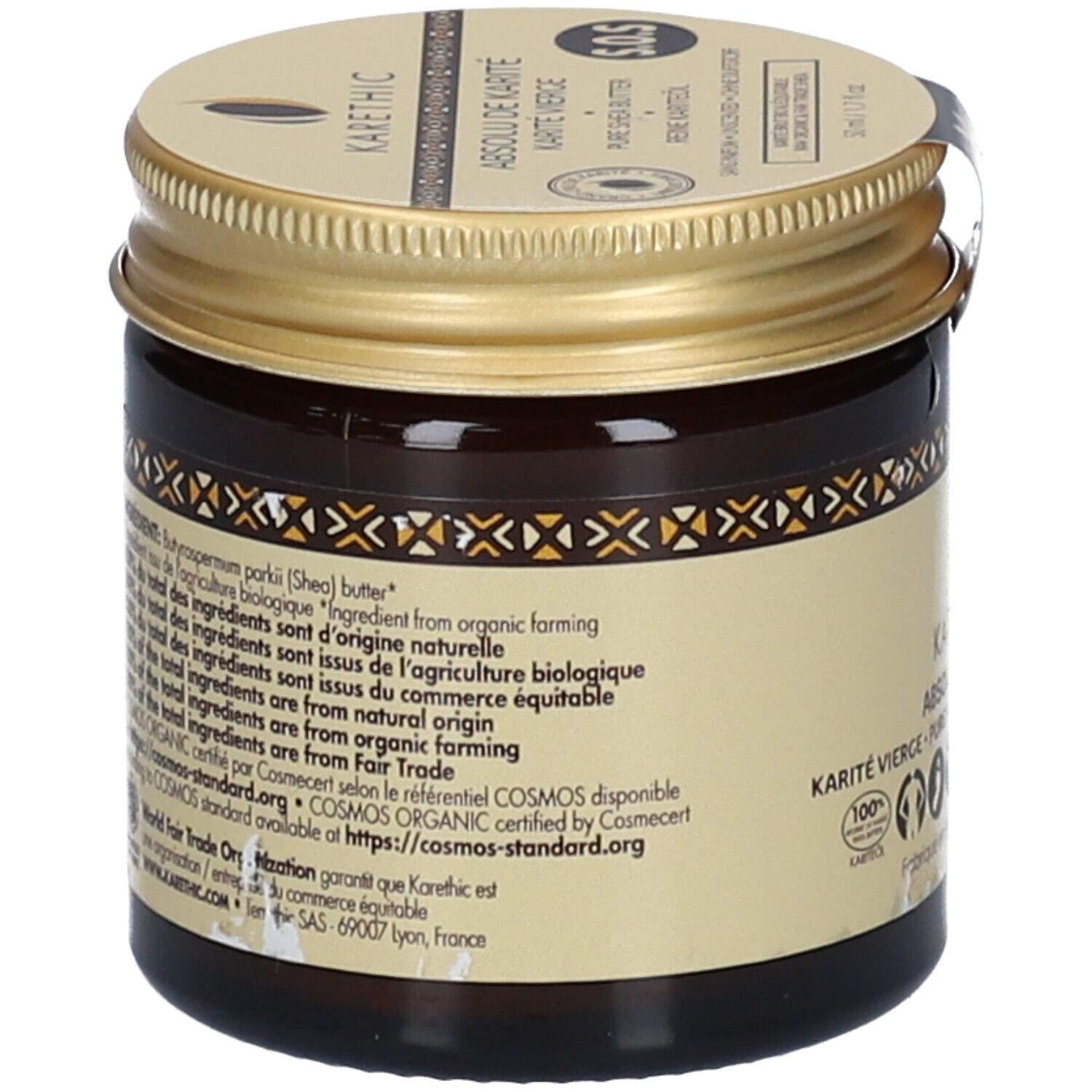 Rückseite einer braunen Glasdose mit goldenem Deckel. Text: Inhaltsstoffe, Herkunft, COSMOS ORGANIC-Zertifizierung, Fair Trade. Bio-Siegel.