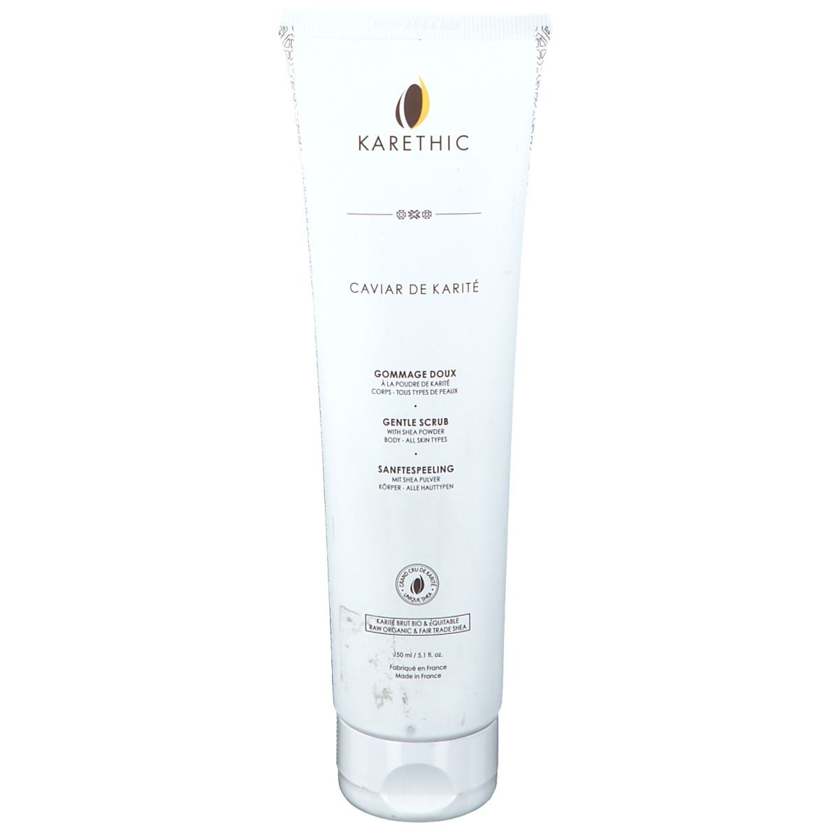 Tube blanche avec textes. En haut: logo KARETHIC et CAVIAR DE KARITÉ. En dessous: GOMMAGE DOUX, GENTLE SCRUB, SANFTES PEELING.