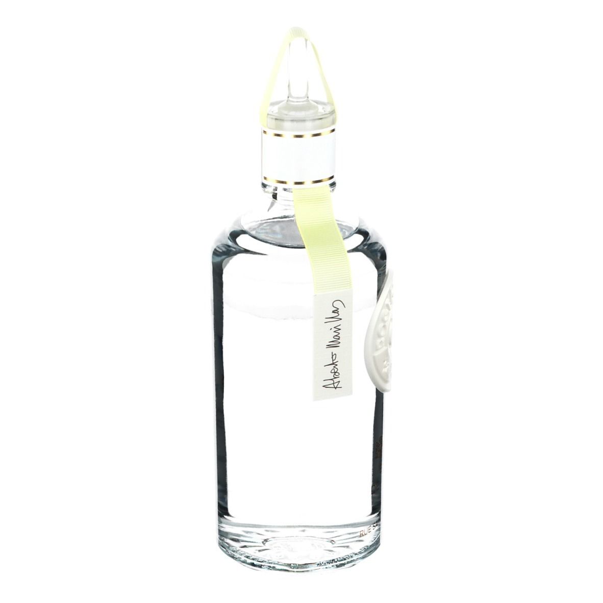 Flacon transparent avec bouchon jaune. Inscription: Roger & Gallet, Extrait de Cologne. Étiquette jaune.