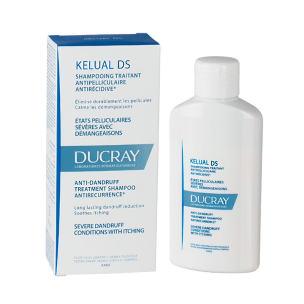 Fles en doos. Opschrift: Kelual DS, Ducray. Anti-roos shampoo voor ernstige jeuk. Witte fles met witte dop.