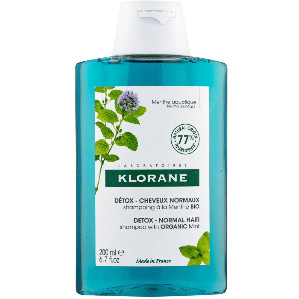 Klorane Shampoo Detox met Watermunt. Fles met groene shampoo, witte dop en etiket met muntillustratie.