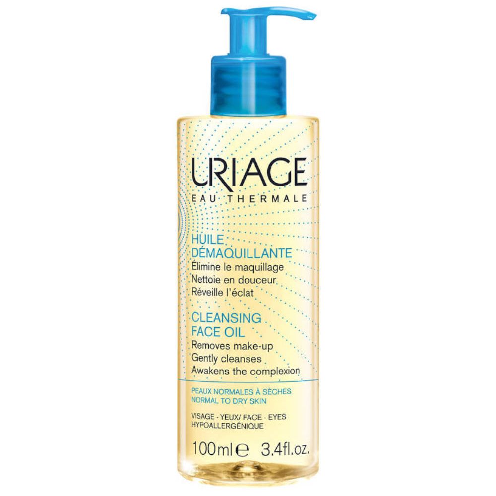 Flacon transparent avec pompe bleue. Inscription: URIAGE, Cleansing Face Oil. Pour peaux normales à sèches.