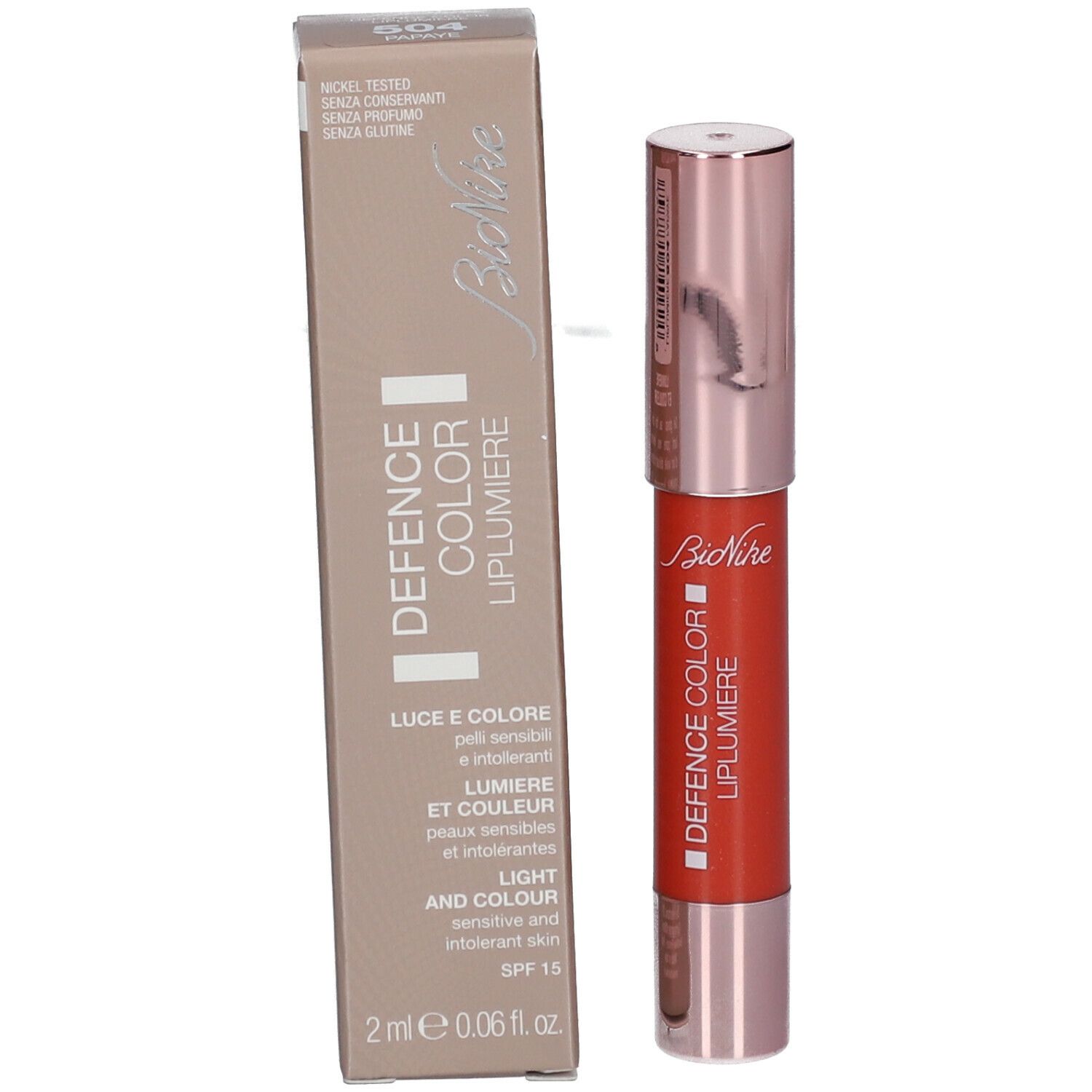 Lipstick en verpakking. Verpakking met opschrift DEFENCE COLOR LIPLUMIERE. Rode lipstick met roségouden dop.