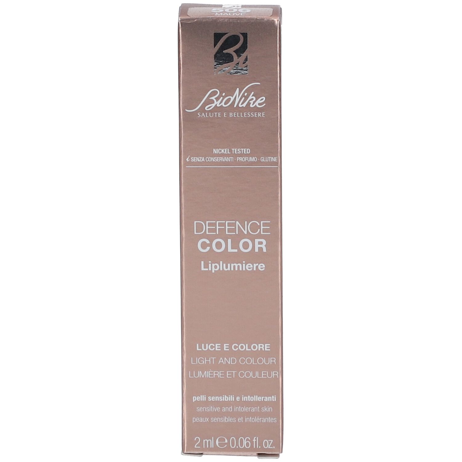Emballage avec fond or rose. Inscription: DEFENCE COLOR LIPLUMIERE, 2 ml.