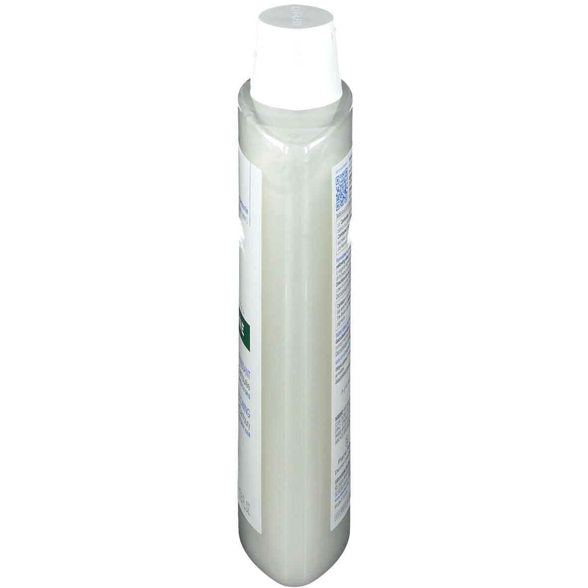 Flacon de shampooing Klorane, vue latérale. Récipient en plastique blanc avec bouchon blanc. Étiquette avec texte et code-barres.