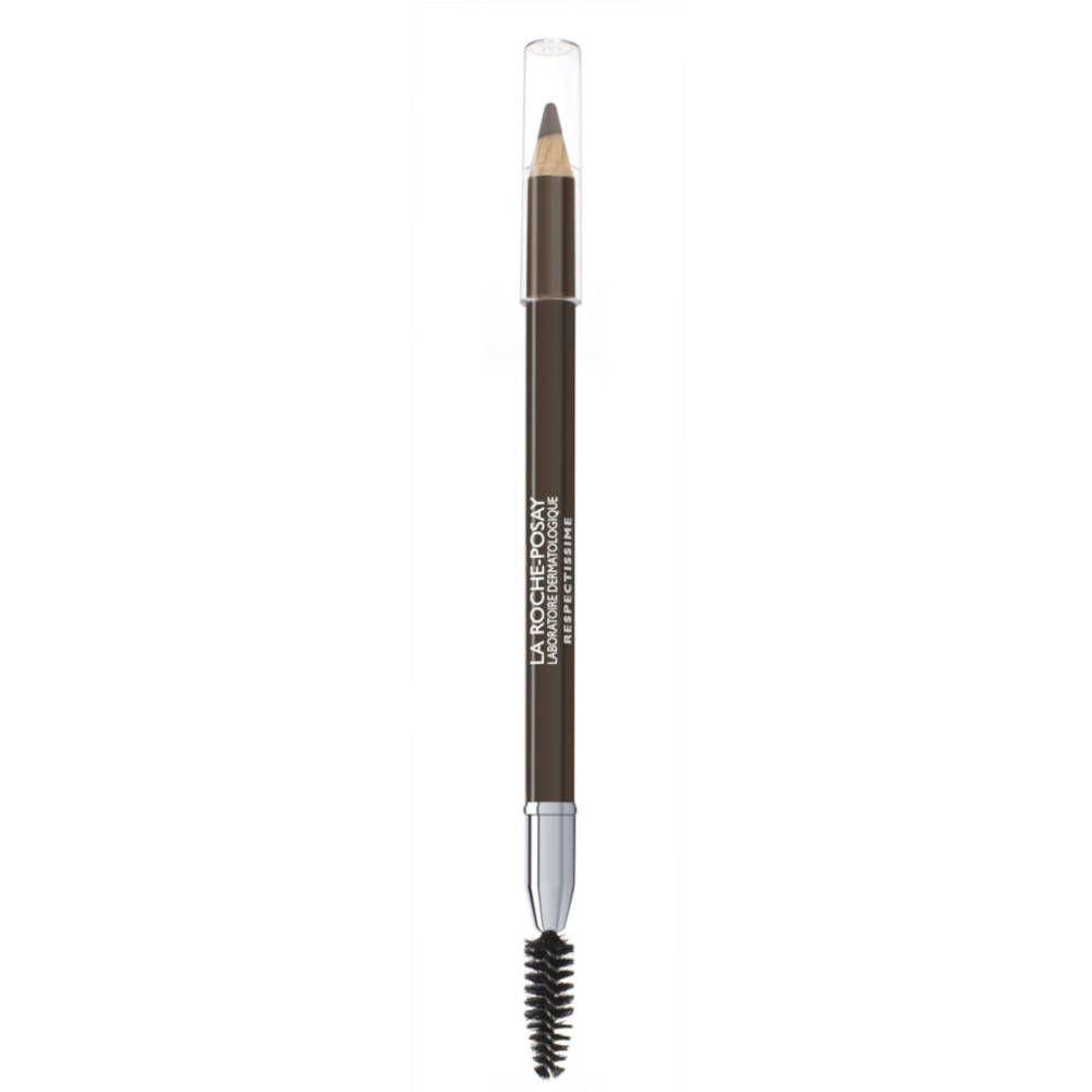 Crayon à sourcils avec brosse et capuchon. Mine marron foncé, corps argenté, brosse noire. Marque visible.