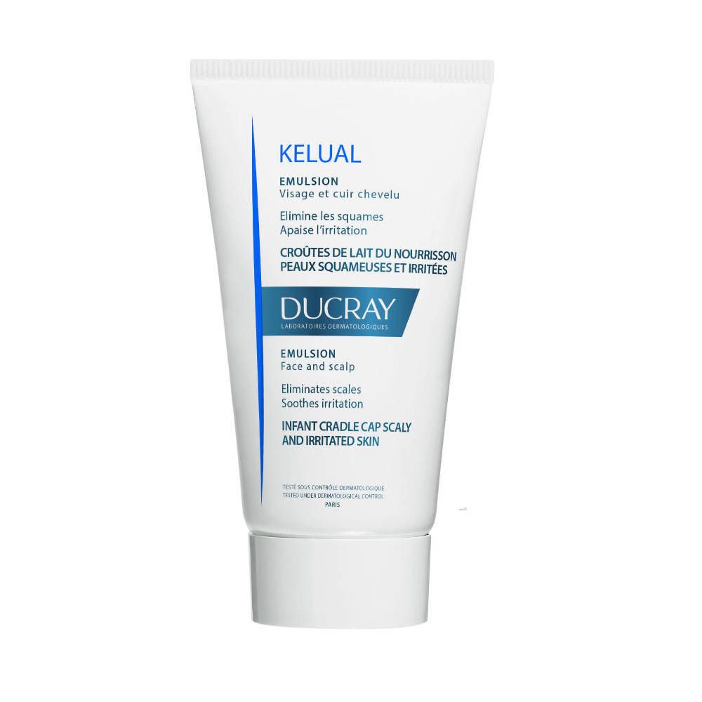 Tube blanc avec texte bleu. Contient KELUAL Emulsion. Textes en français et anglais. Marque : DUCRAY.