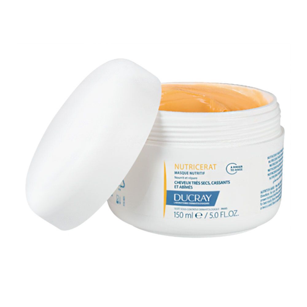 Pot blanc avec couvercle ouvert. Produit orange visible. Inscription: NUTRICERAT, DUCRAY. 150 ml/5.0 FL.OZ.