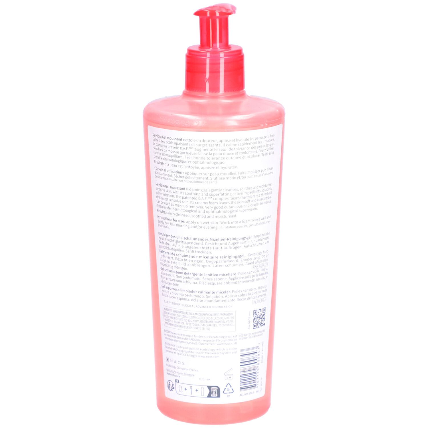 Retro di un flacone rosa con dosatore. Testo in più lingue. Codice a barre e altri simboli.