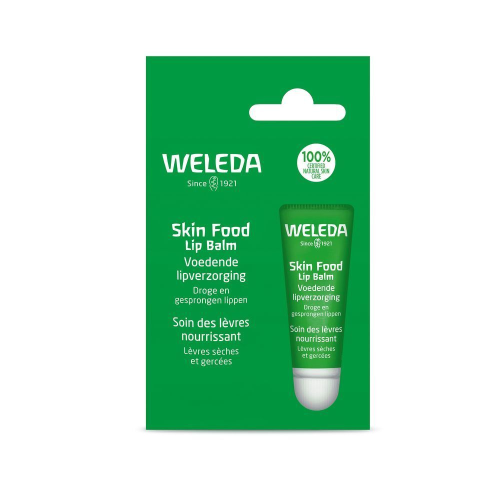Grüne Verpackung mit Tube. Aufschrift: Weleda Skin Food Lip Balm. Enthält eine Tube Lippenbalsam.