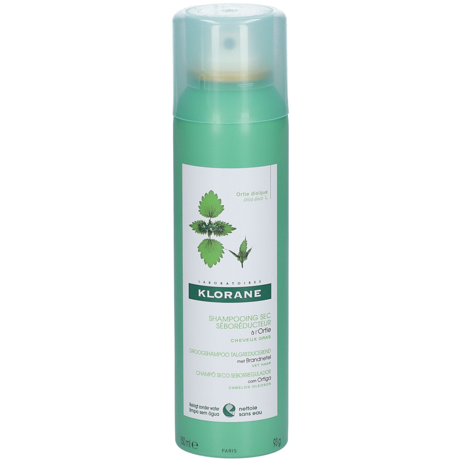 Flacon vert de shampooing sec. Étiquette avec illustration de plante et nom du produit.