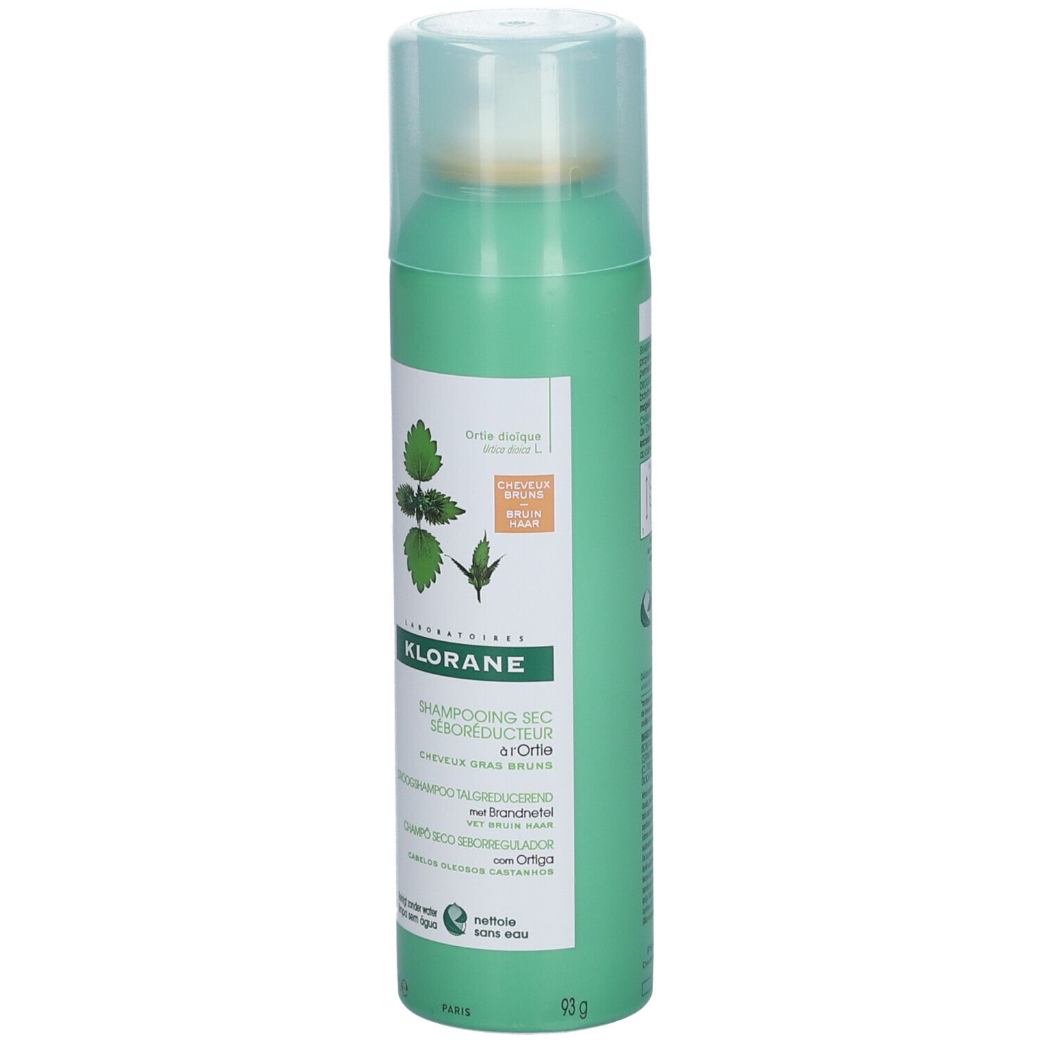 Groene spuitfles met droogshampoo. Opschrift: KLORANE, Shampooing Sec Séboréducteur à l'Ortie. Met brandnetel.