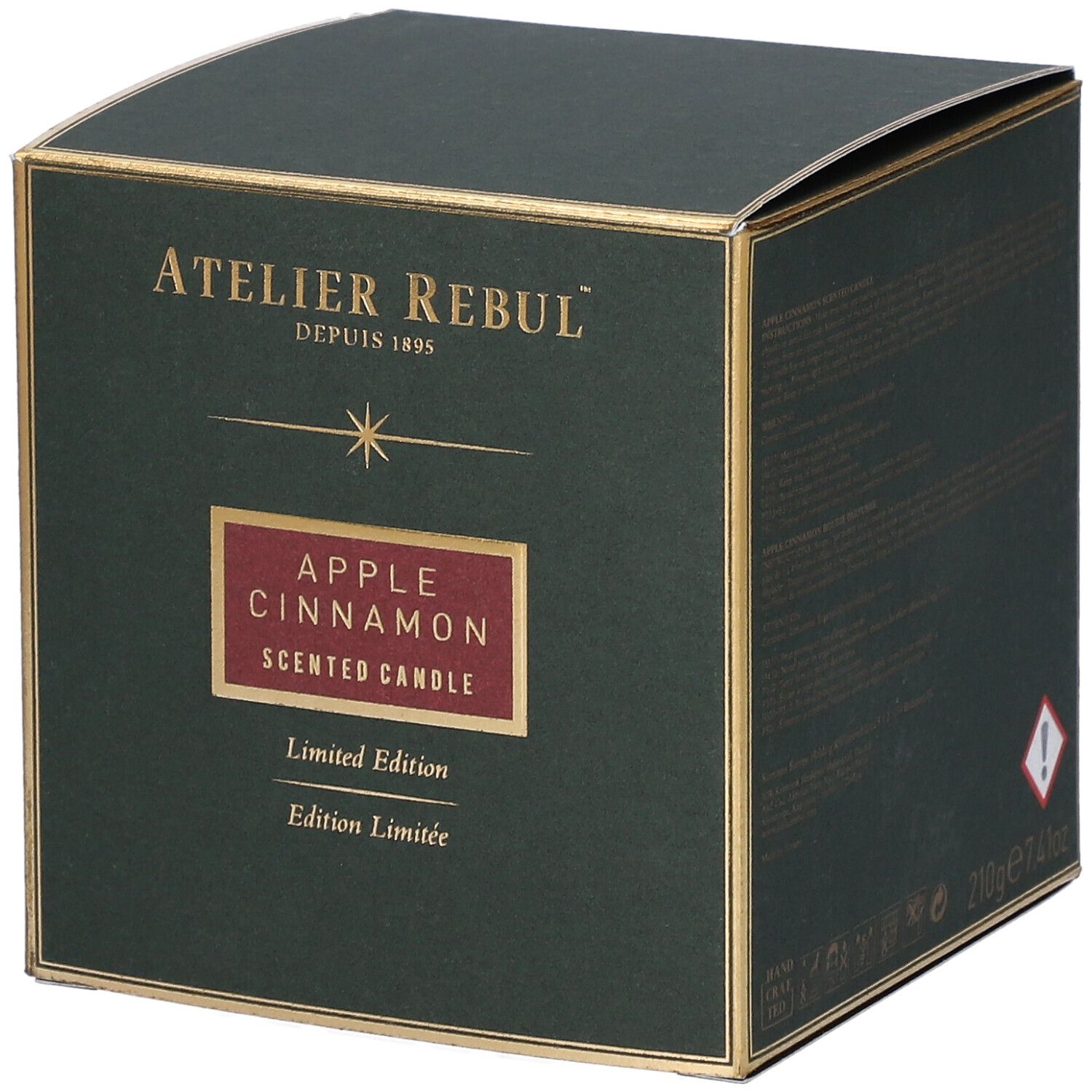 Groene doos met gouden accenten. Opschrift "ATELIER REBUL", "APPLE CINNAMON", "Limited Edition".