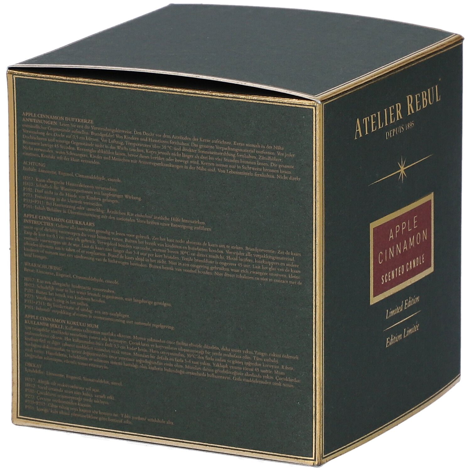 Groene doos met gouden accenten. Opschrift "ATELIER REBUL", "APPLE CINNAMON", "Limited Edition".