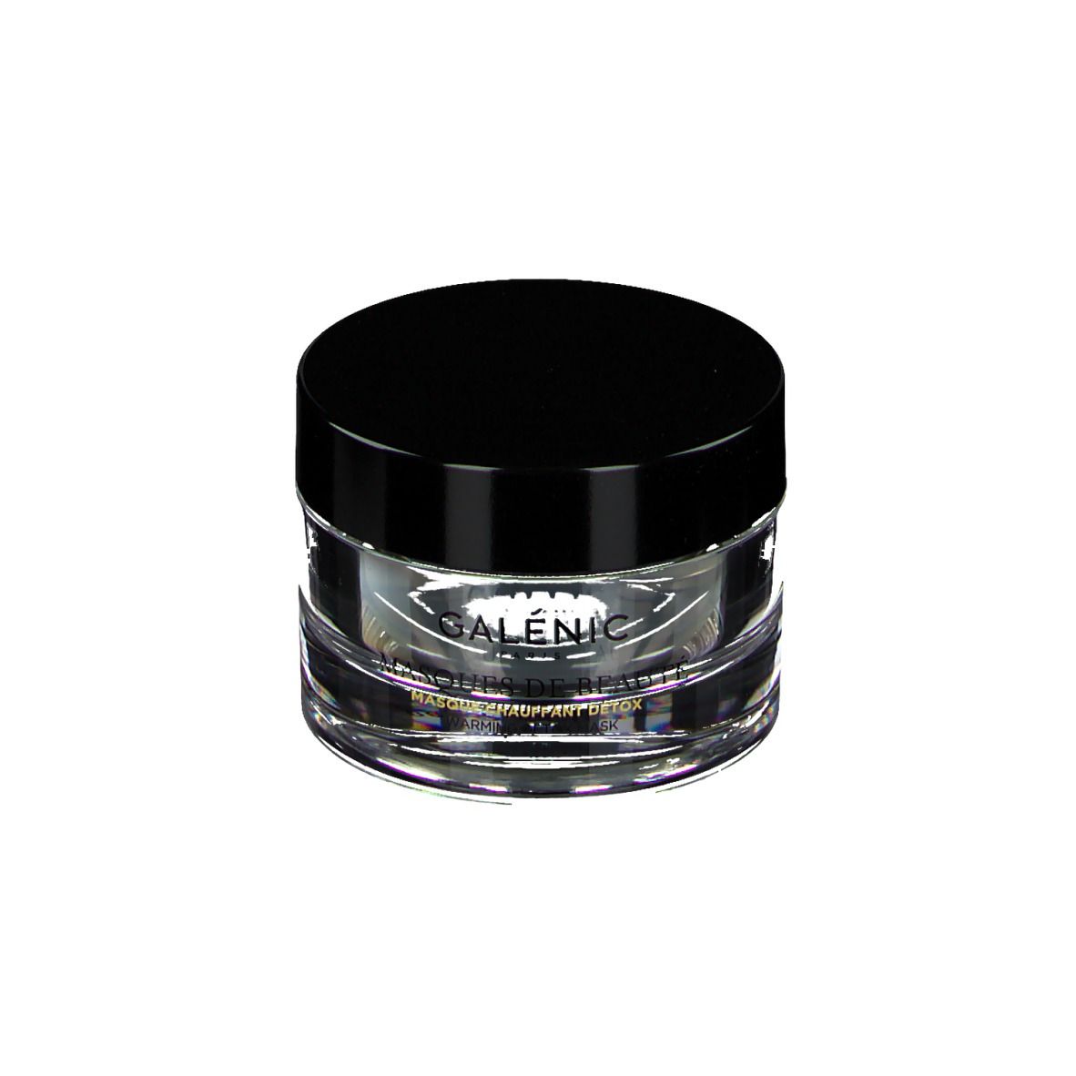 Pot rond en verre transparent avec couvercle noir. Inscription: GALÉNIC, MASQUES DE BEAUTÉ, MASQUE CHAUFFANT DÉTOX.