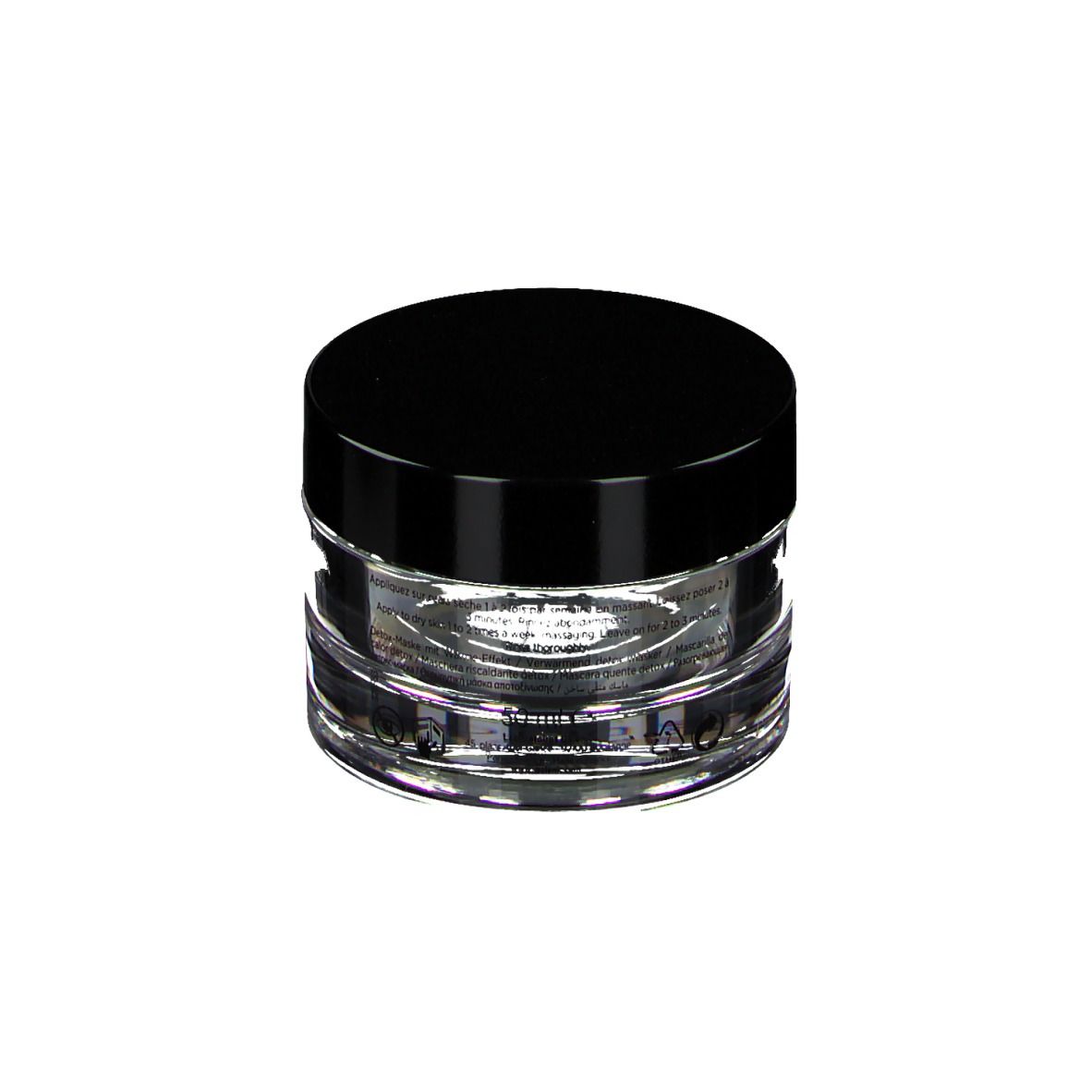 Pot rond en verre transparent avec couvercle noir. Inscription: GALÉNIC, MASQUES DE BEAUTÉ, MASQUE CHAUFFANT DÉTOX.