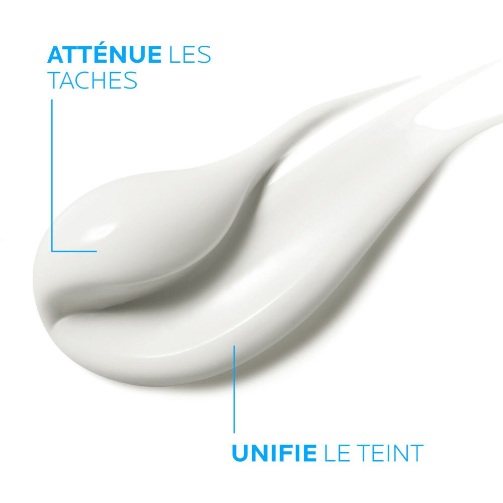 Éclaboussure de crème blanche. Texte : Atténue les taches, Unifie le teint.