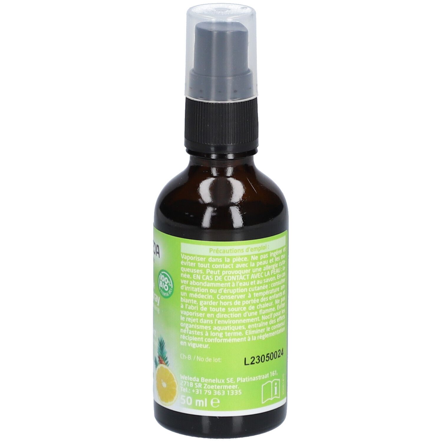 Flacon en verre brun avec vaporisateur. Étiquette avec WELEDA, citron, ananas et texte. Label 100% Bio.