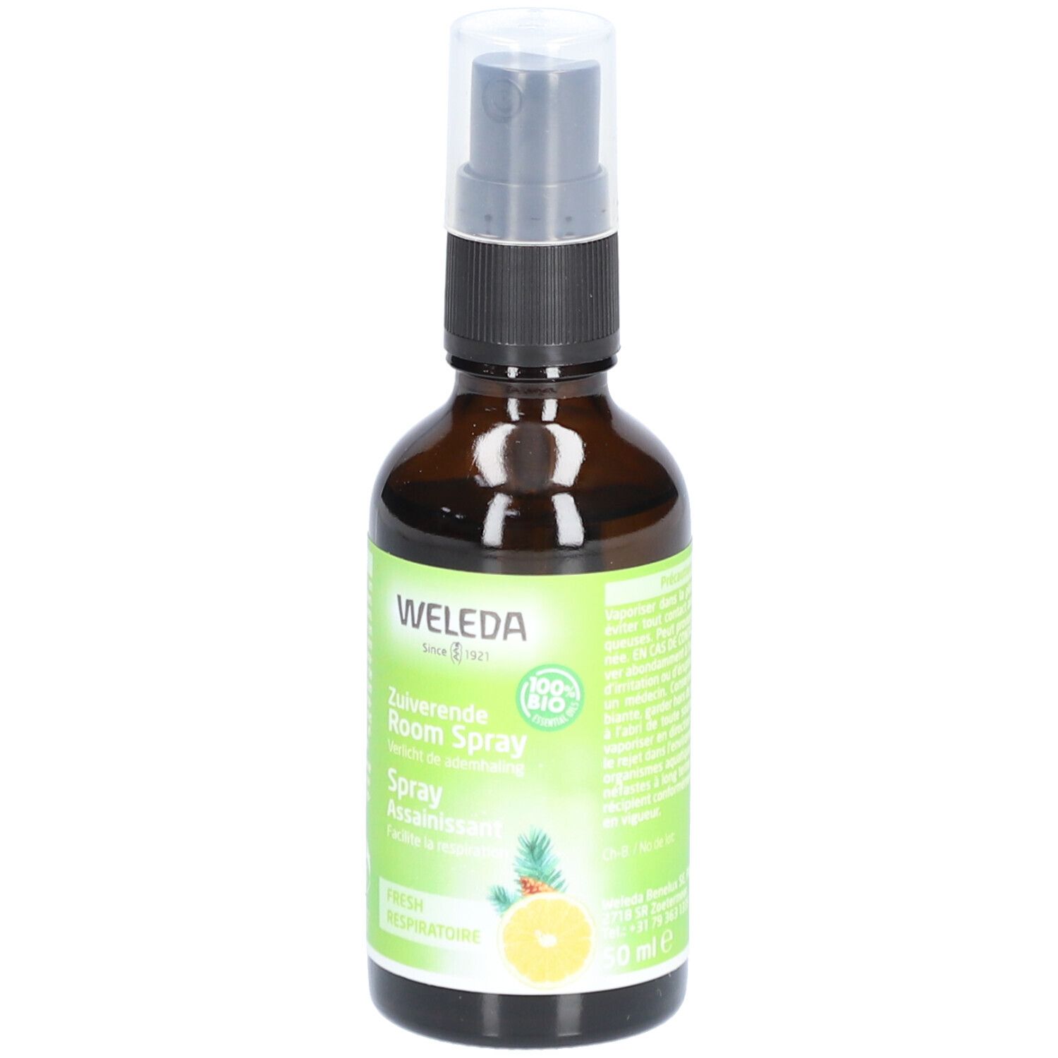 Flacon en verre brun avec vaporisateur. Étiquette avec WELEDA, citron, ananas et texte. Label 100% Bio.