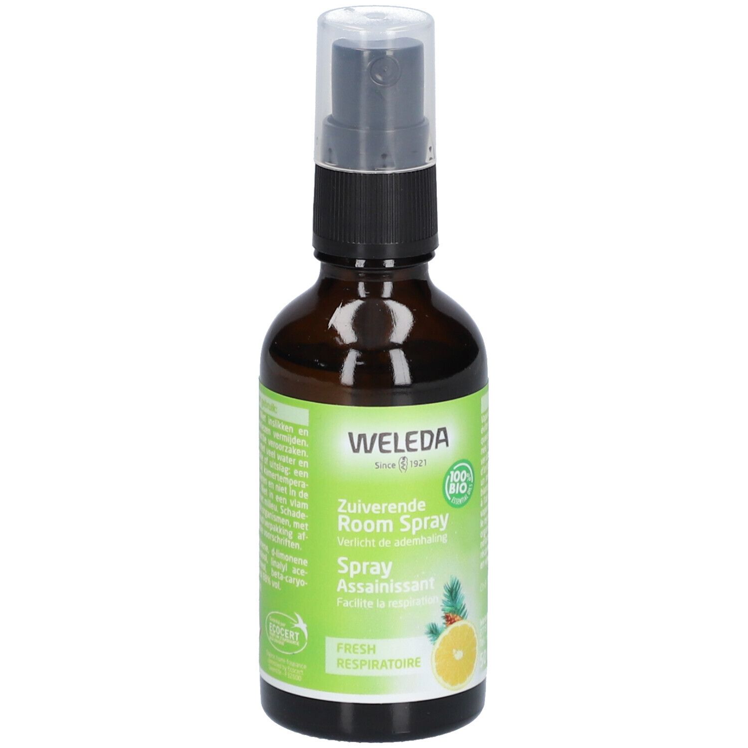 Flacon en verre brun avec vaporisateur. Étiquette avec WELEDA, citron, ananas et texte. Label 100% Bio.