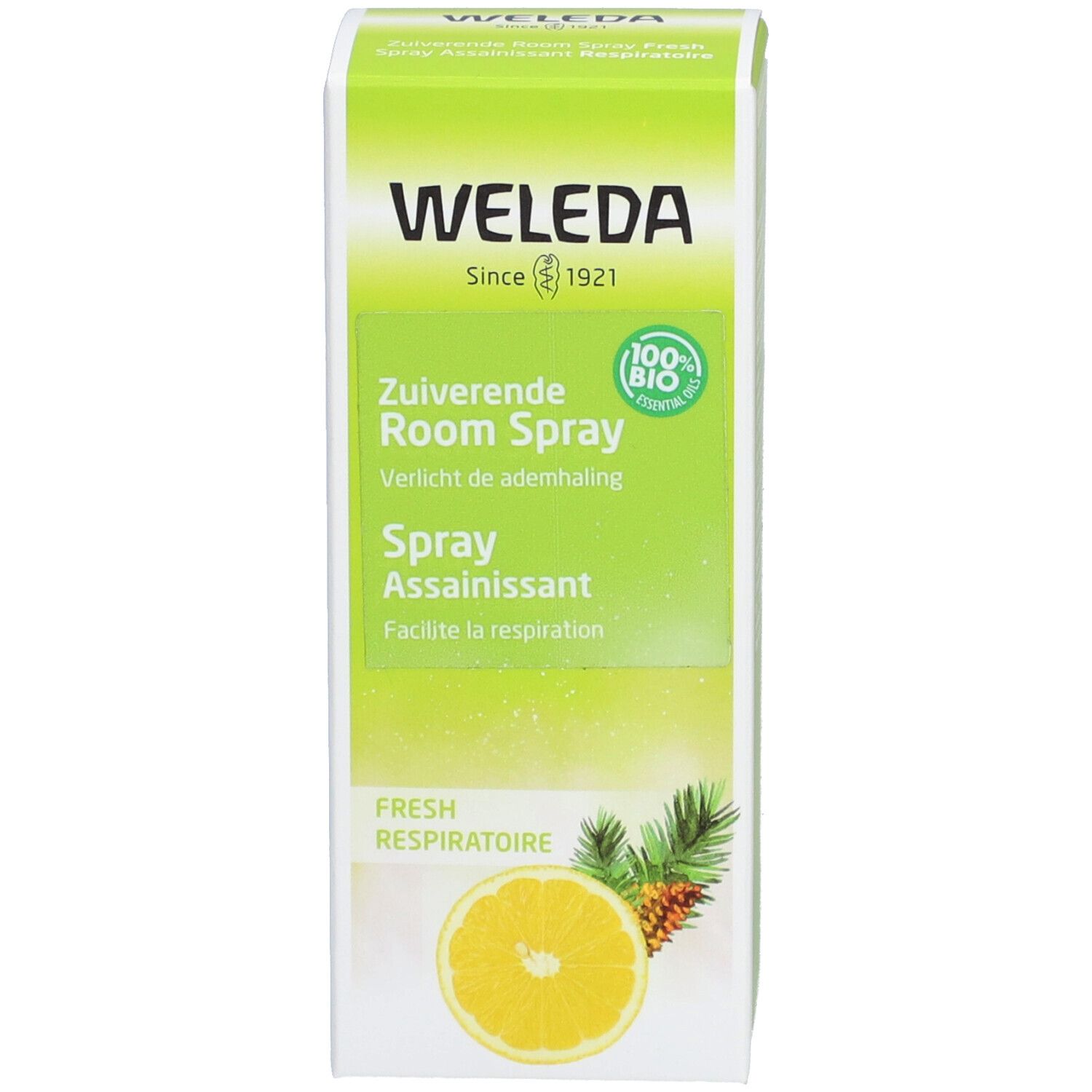 Emballage blanc avec logo WELEDA et nom du produit. Illustration de citron, ananas et branches de pin. Texte.
