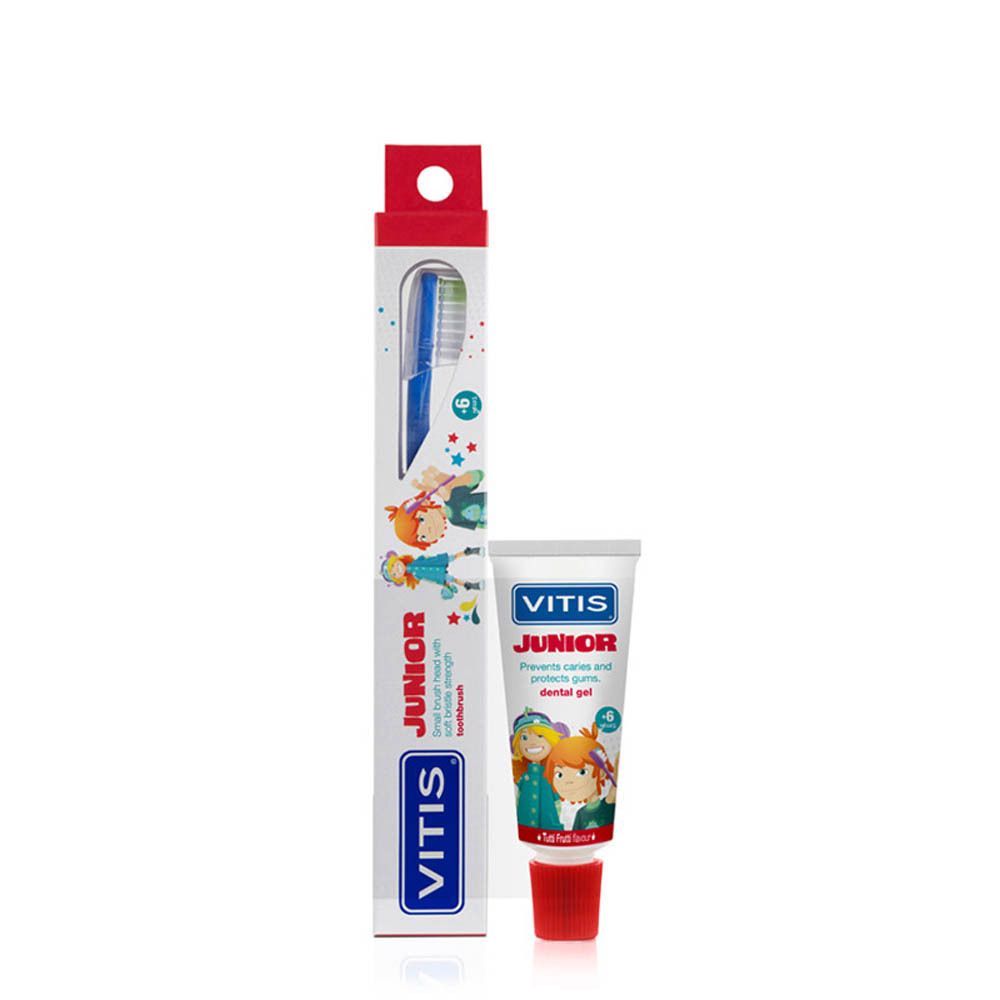 Brosse à dents VITIS Junior et gel dentaire dans un emballage. Boîte blanche avec illustrations et logo VITIS Junior. Tube rouge.
