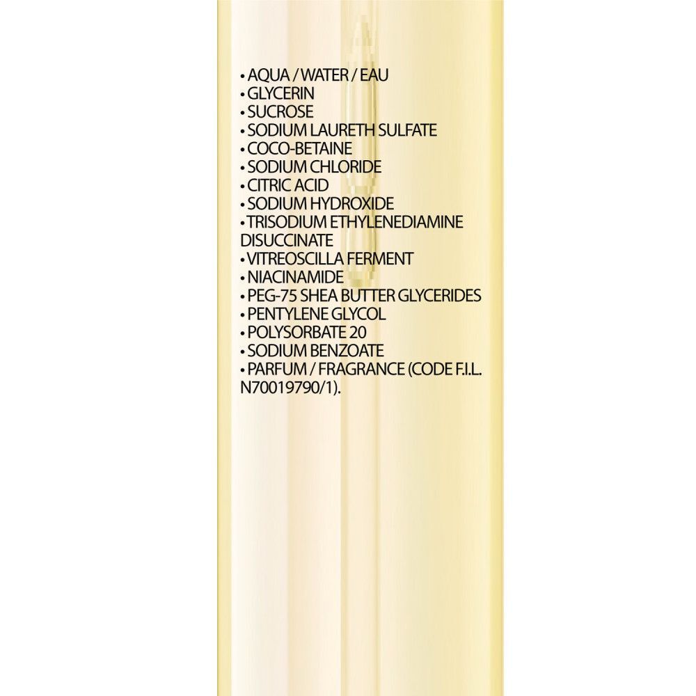 La Roche-Posay Lipikar Huile Lavante AP+. Fles met pomp. Tekst met instructies. Hand raakt fles aan.