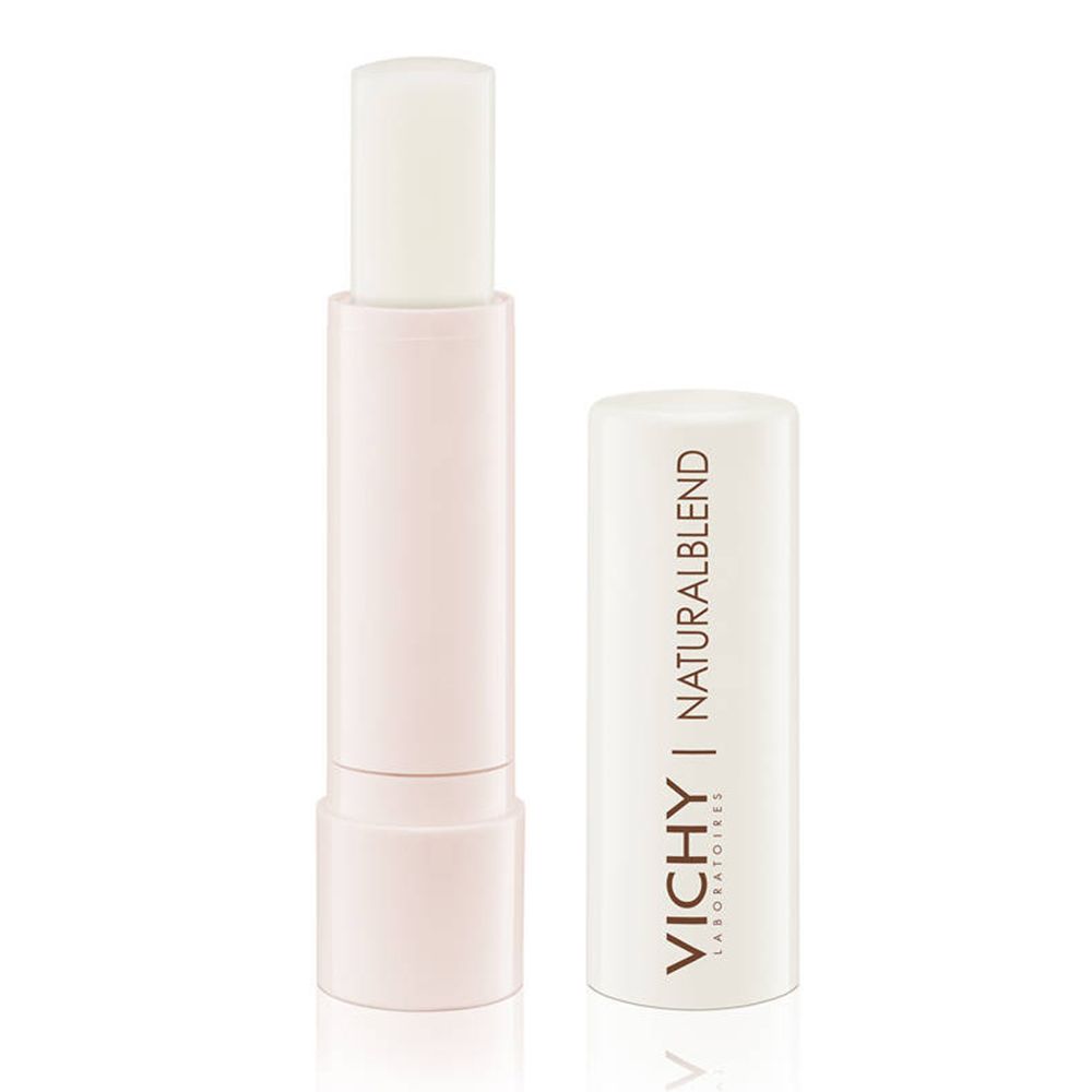 Baume à lèvres ouvert. Capuchon blanc avec VICHY et NATURALBLEND. Le baume est transparent et dans un contenant rose clair.