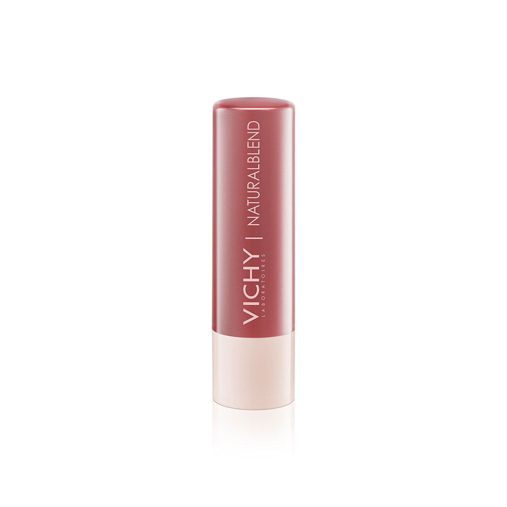 Lippenbalsam in Stiftform. Farbton nude. Marke VICHY NATURALBLEND. Weißer Boden, roter Deckel.