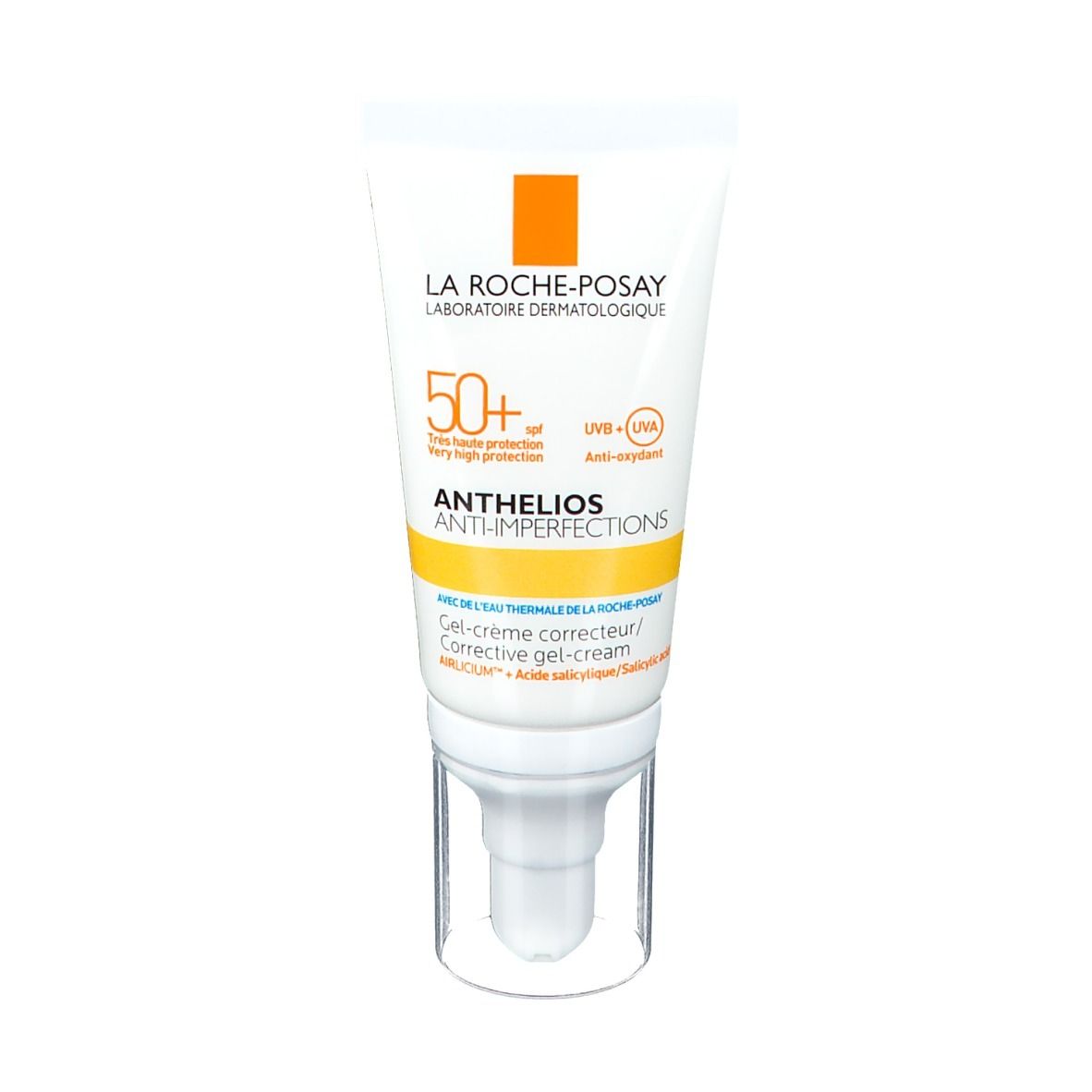 Tube blanche avec accent jaune. Inscription: ANTHELIOS ANTI-IMPERFECTIONS LSF 50+. Avec distributeur.