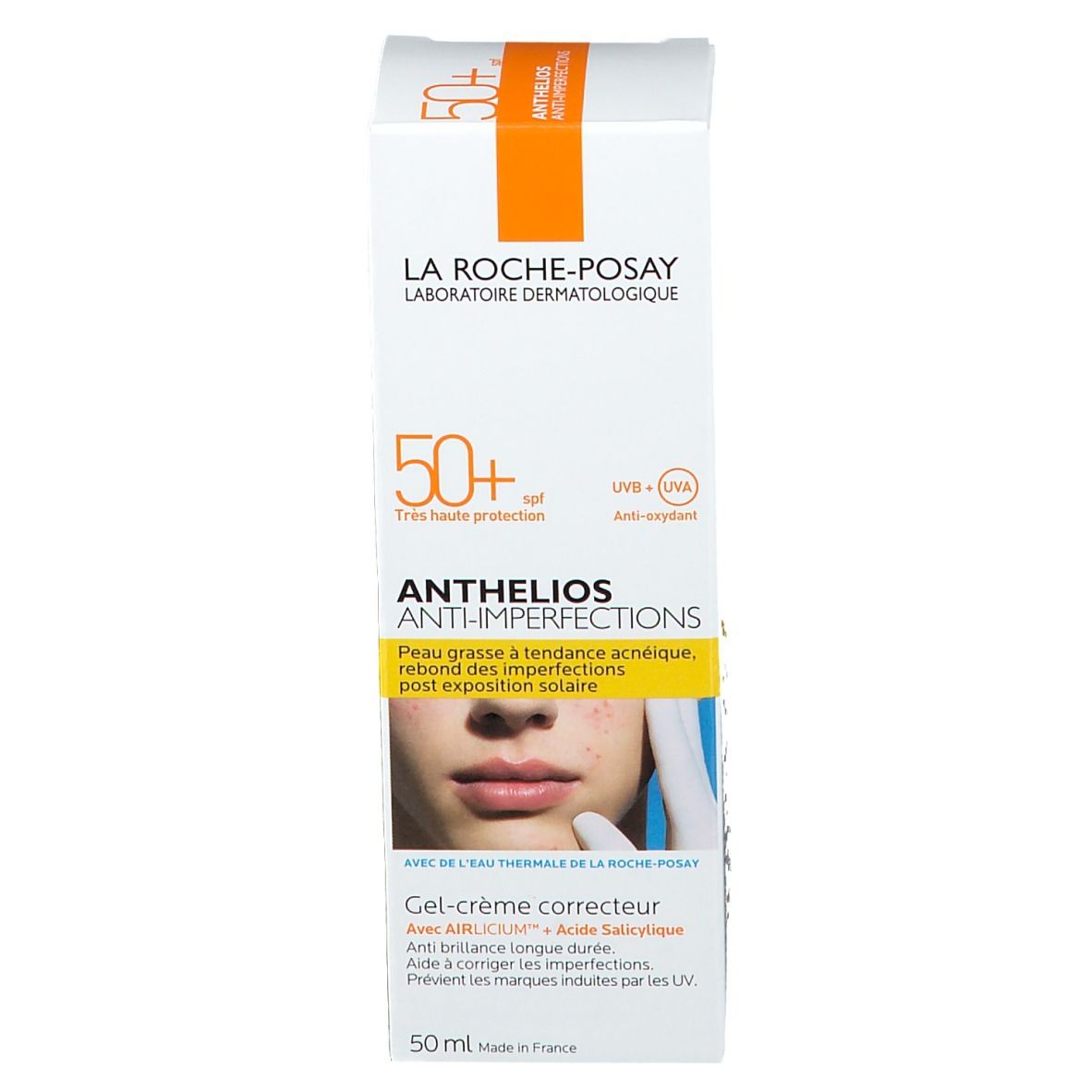 Emballage carton. Inscription: ANTHELIOS ANTI-IMPERFECTIONS. Image d'un visage. SPF 50+.