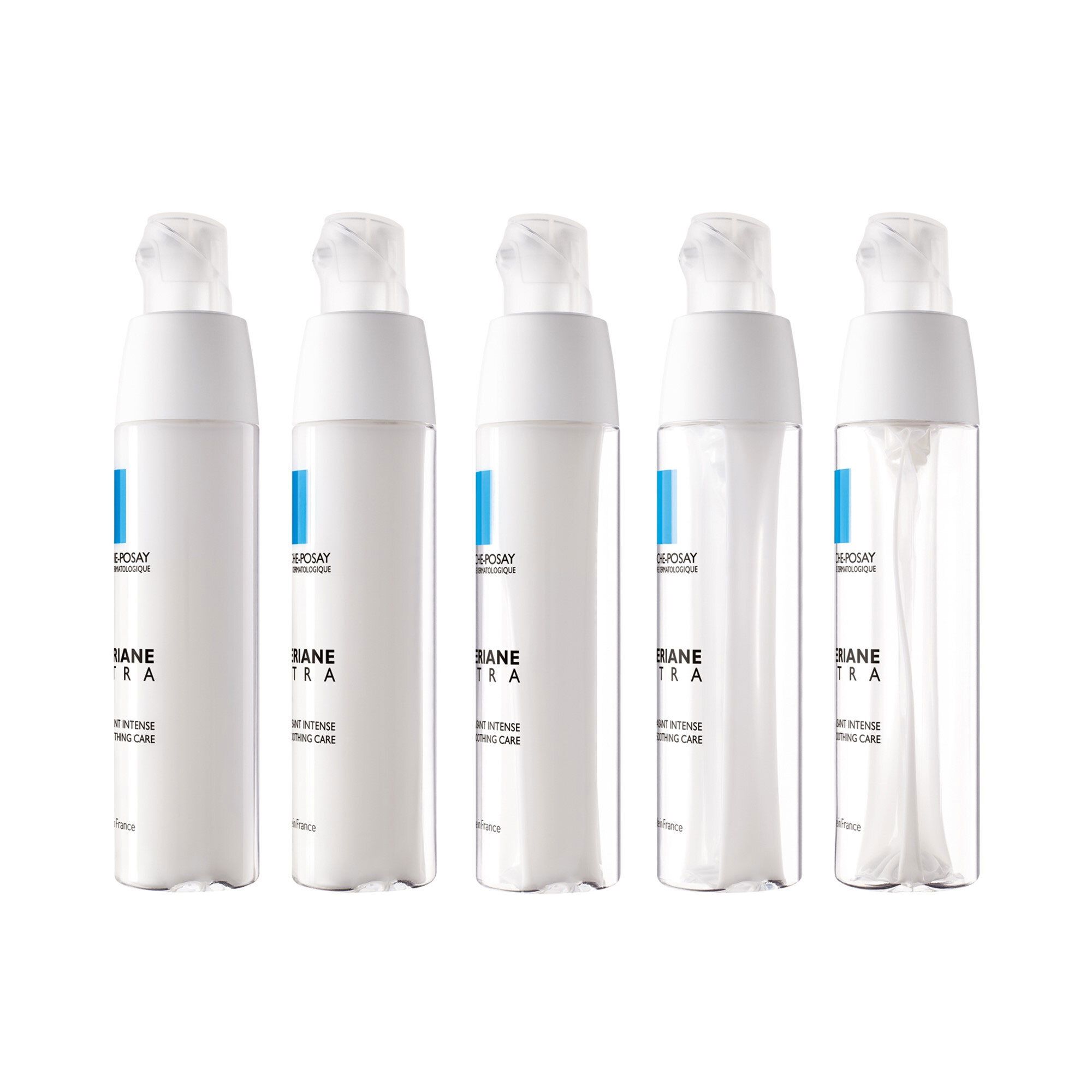 Vijf flessen La Roche-Posay Tolerian Ultra Fluide. Witte flessen met blauw accent.