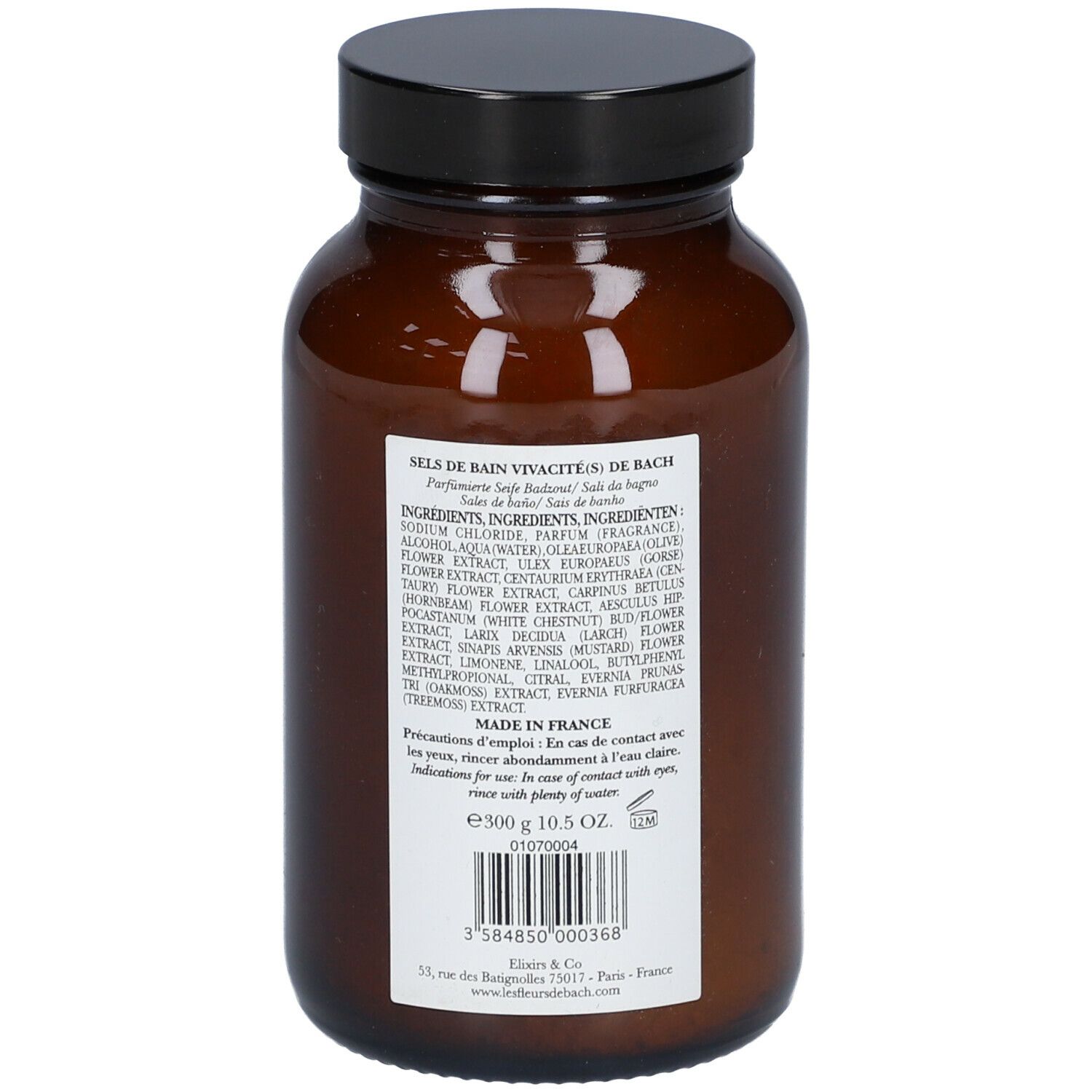 Dos d'un flacon en verre brun avec couvercle noir. Étiquette avec ingrédients et informations. Fabriqué en France.