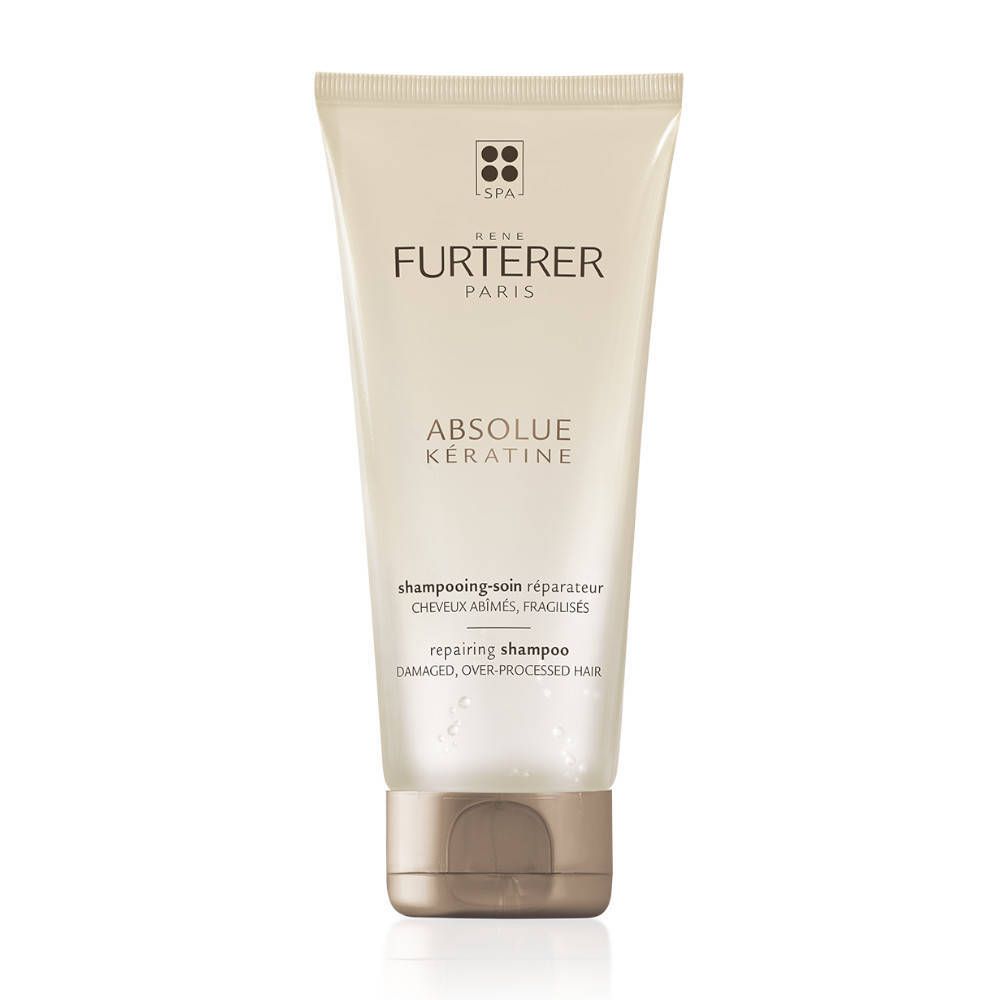 Tube beige de shampooing. Inscription: René Furterer, Absolue Kératine. Texte: Shampooing-soin réparateur.