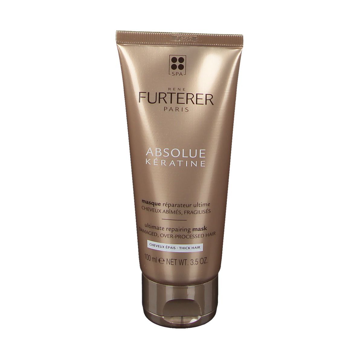 Tube dorée. Inscription: RENE FURTERER, ABSOLUE KERATINE. Texte: Ultimate repairing mask. Pour cheveux épais.