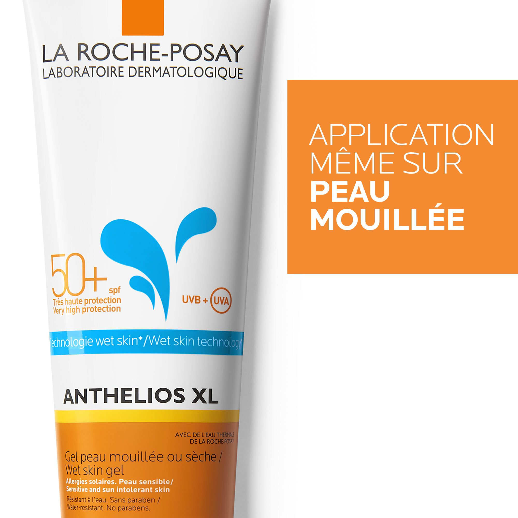 Detail van de tube. Opschrift: LA ROCHE-POSAY, ANTHELIOS XL, 50+ SPF, Wet Skin technologie. Oranje tekst: APPLICATION MÊME SUR PEAU MOUILLÉE.