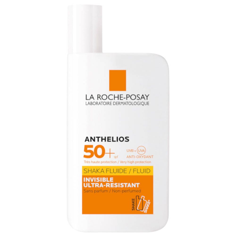 Weißes Fläschchen mit orangefarbenen Akzenten. Aufschrift: ANTHELIOS 50+. Shaka Fluide. Ultra-Resistent. Ohne Parfüm.